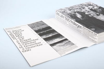 Dust jacket around thread-stitched brochure -