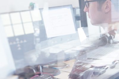 Employee controlling music at Authoring Studio und Encoding House Press9 of optimal media in Germany